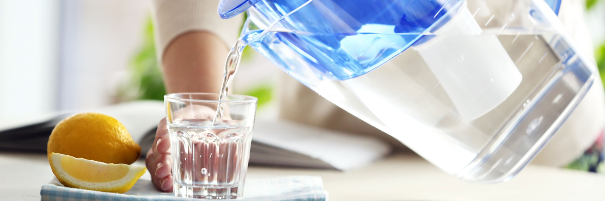 Pouring water into glass